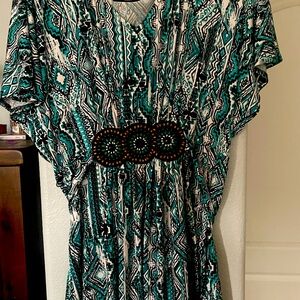 Cute colorful dress with tie back.